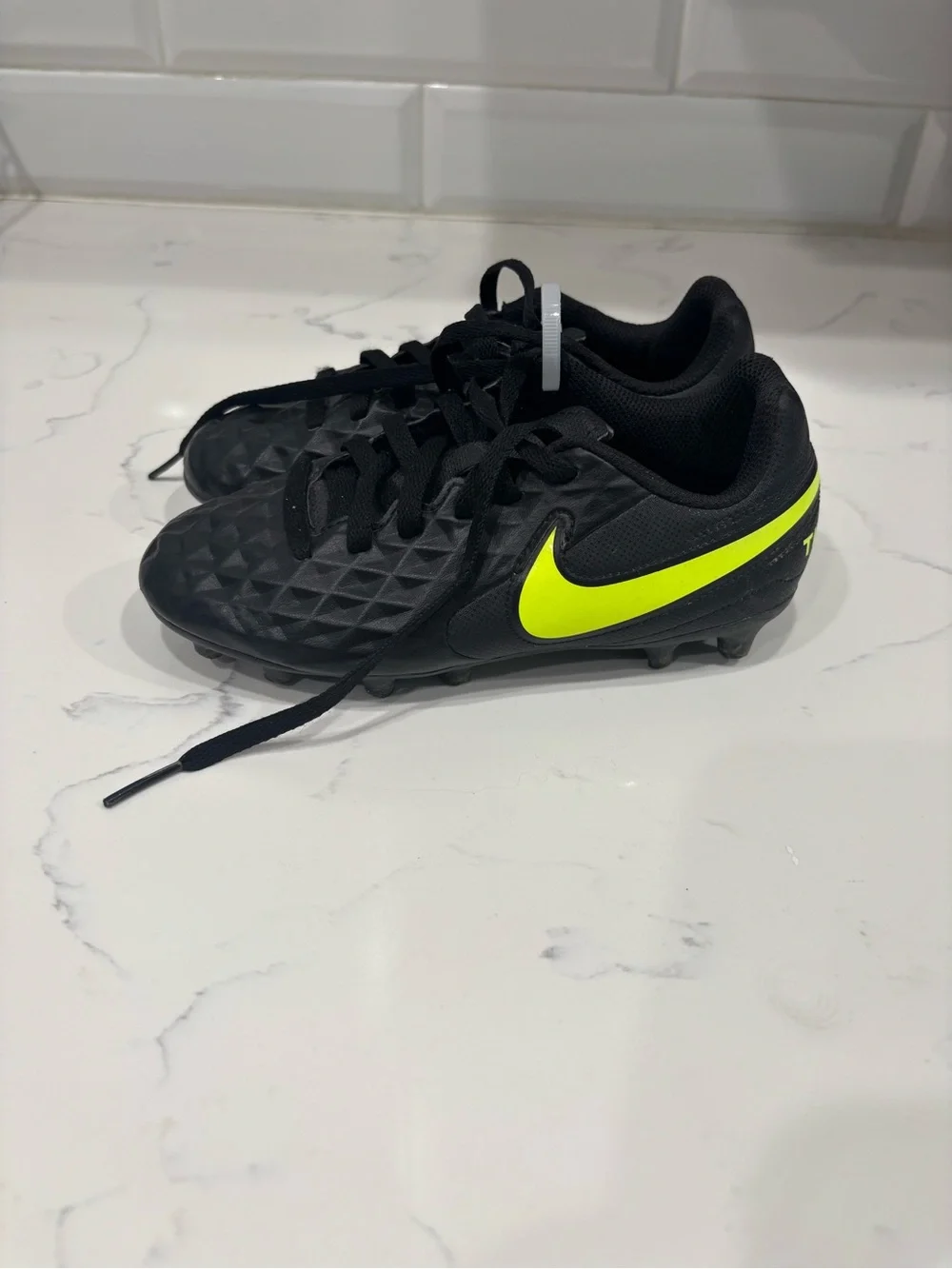 Nike Kids Black Soccer Cleats with Neon Yellow Swoosh